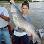 Woman with 34.5 inch 26Lbs Femail Chanel Catfish on a boat