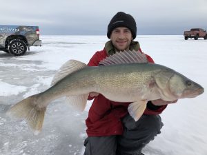 ice angler with trophy Lake Winnipeg walleye ice fishing 