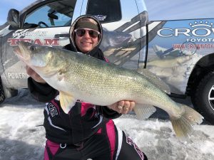 Lady Ice angler proudly displaying her trophy lake winnipeg ice fishing walleye 