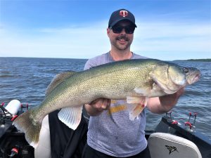 walleye fisherman holding huge lake winnnipeg walleye