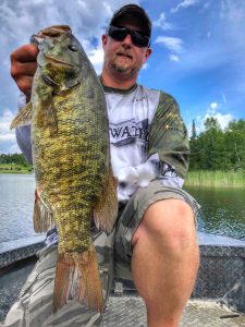 Donovan Pearase samallmouth bass fishing guie holding large smallmouth bass 