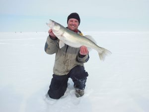 Ice fishing guide at Lake Winnipeg