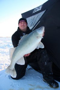 Donovan Pearase of Blackwater cats with a monster 15 lbs fish of a lifetime Lake Winnipeg Greenback